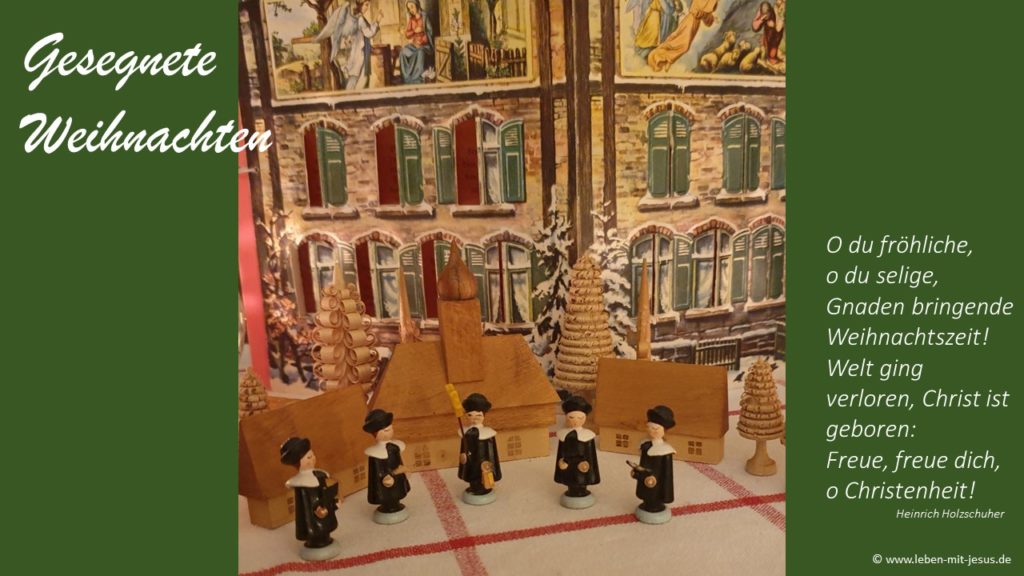 e-cards zu Weihnachten Weihnachtszeit christliche e-cards mit Weihnachtslied besonders stimmungsvolle e-card mit Kurrendesänger Holzfiguren Chor Sängergruppe